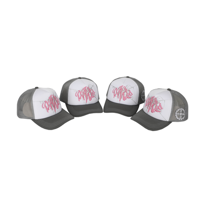The Cap Broken Glass Grey/Pink by 22DABE22. A black six-panel cap with a lilac broken glass design embroidered on the front and 22DABE22 logo on the side. Adjustable strap at the back for a customized fit, pre-curved visor to shield from sun and rain, and breathable eyelets on top to keep the head cool and dry. Perfect accessory to elevate your streetwear game.