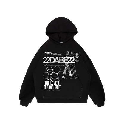 A long sleeve hooded sweatshirt with a big screenprint on the front, featuring the Terror and Love Hoodie. The distressed finish gives it a rugged look and it has an oversized fit perfect for layering or lounging. It has an extra big pocket at the front and is made from a premium blend of 80% cotton and 20% polyester with a soft peached interior. Unisex design suitable for anyone looking to add some edge to their wardrobe.