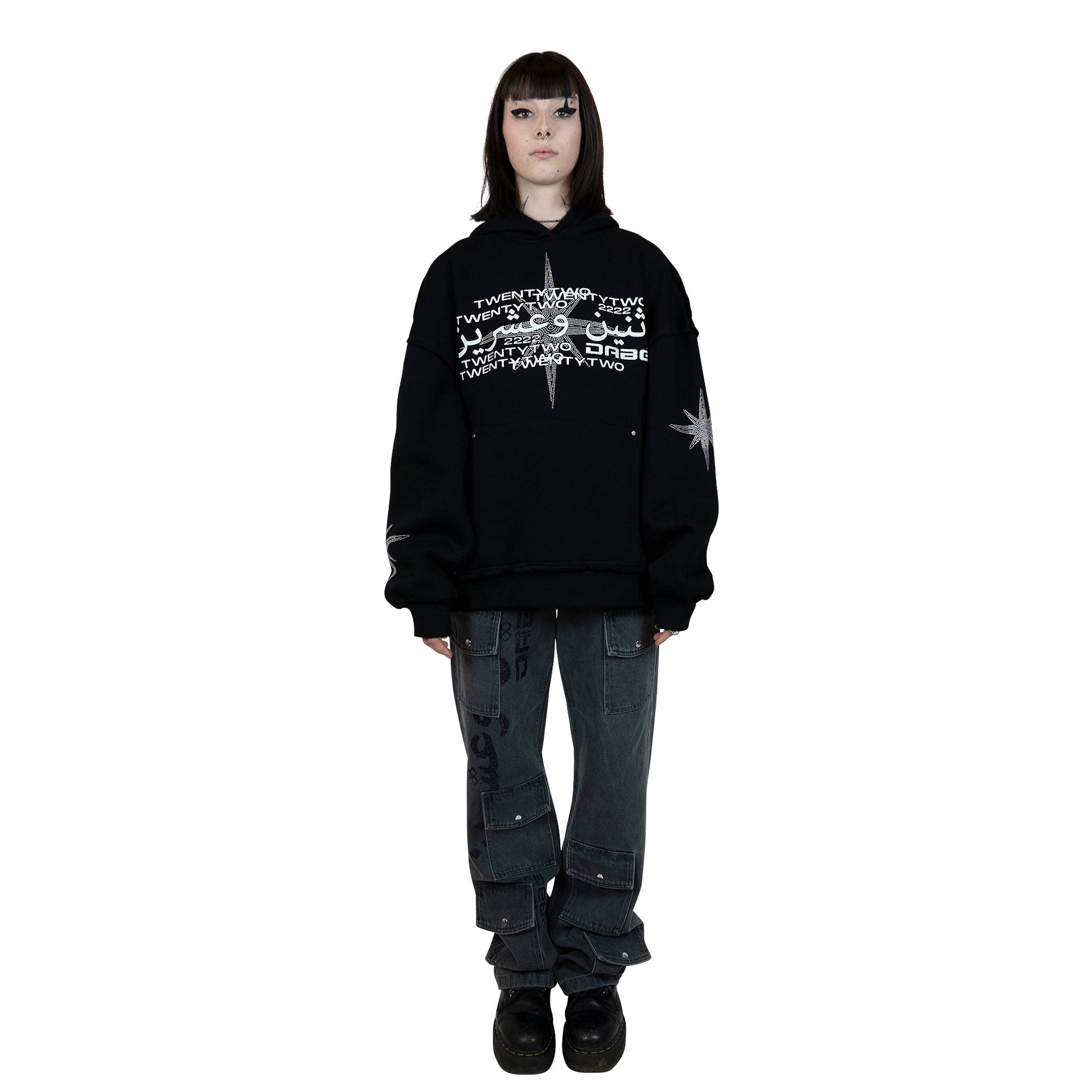 A black hoodie with unique rhinestone and screenprint design on the front, stars made of rhinestones on the sleeves and back, and a vintage, distressed finish. Made from a blend of cotton and polyester, with a peached interior for a cozy feel. Oversized unisex fit and extra big pocket make it practical for any occasion.
