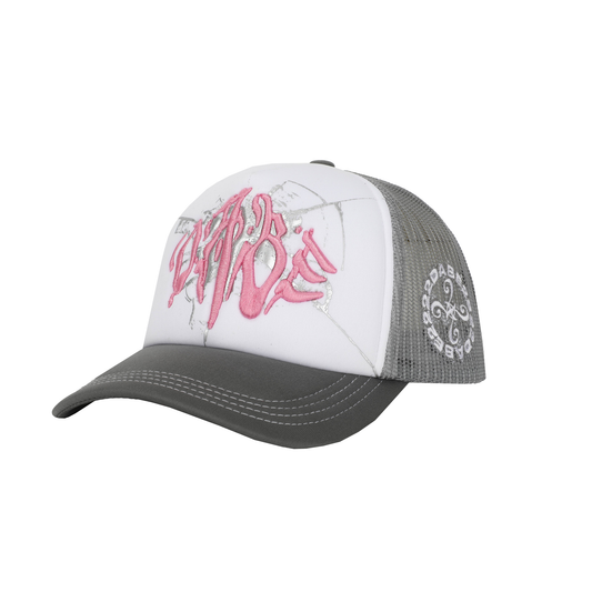 The Cap Broken Glass Grey/Pink by 22DABE22. A black six-panel cap with a lilac broken glass design embroidered on the front and 22DABE22 logo on the side. Adjustable strap at the back for a customized fit, pre-curved visor to shield from sun and rain, and breathable eyelets on top to keep the head cool and dry. Perfect accessory to elevate your streetwear game.
