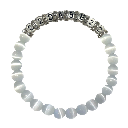 Two Glass Pearl Bracelets by 22DABE22, one in black and the other in white, featuring shimmering glass pearls on a stretchy elastic band. Perfect for elevating your style, formal events or everyday wear. Handcrafted with high-quality materials.